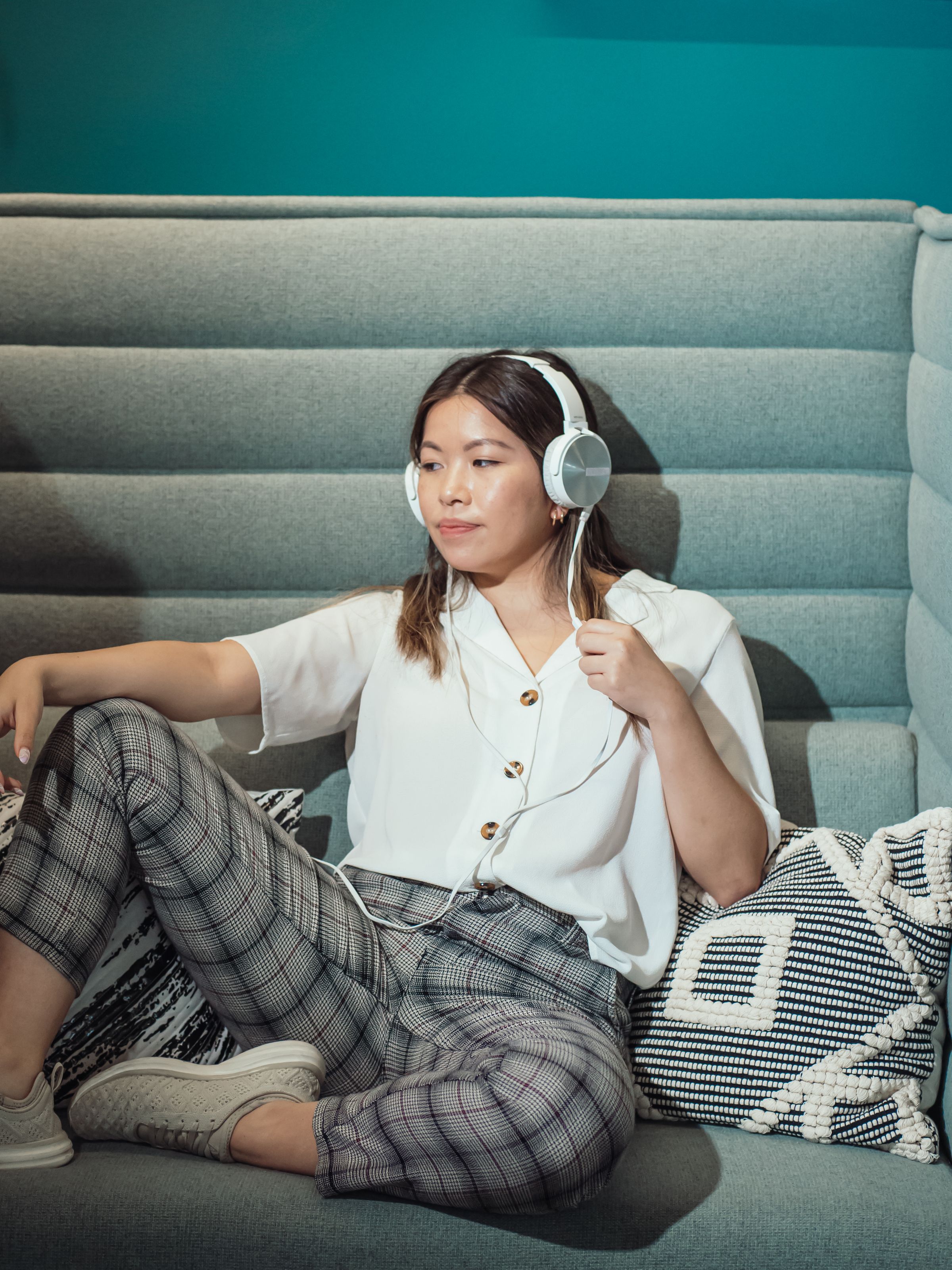A person unwinding at home with headphones